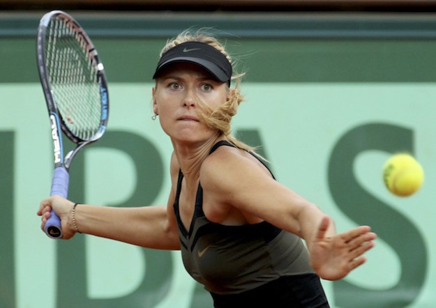 Sharapova of Russia returns the ball to Errani of Italy during their women's singles final match at the French Open tennis tournament at the Roland Garros stadium in Paris